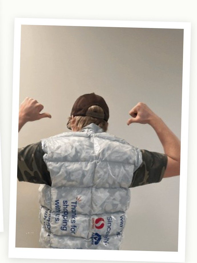 Bag puffer vest prototype, back, showing printed bag text as pattern
