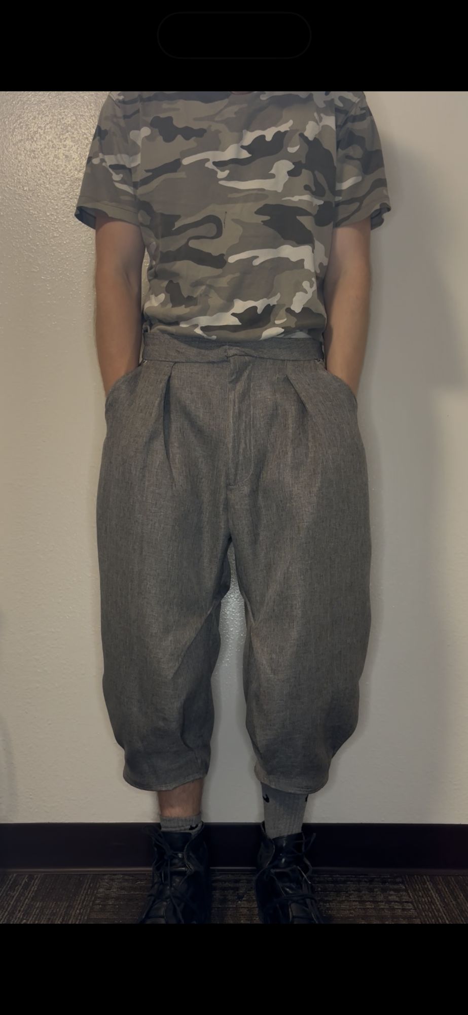 Balloon pleat trouser, back view showing curved leg vents