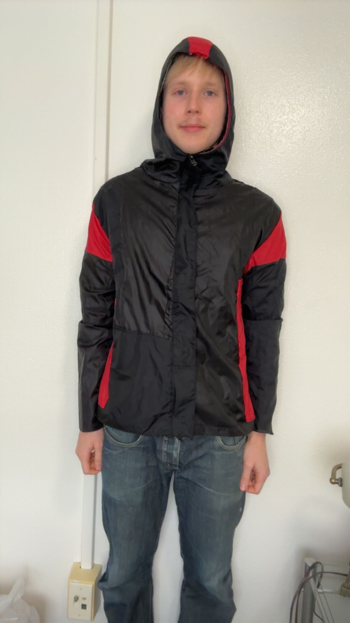Rain jacket front, zipped, worn