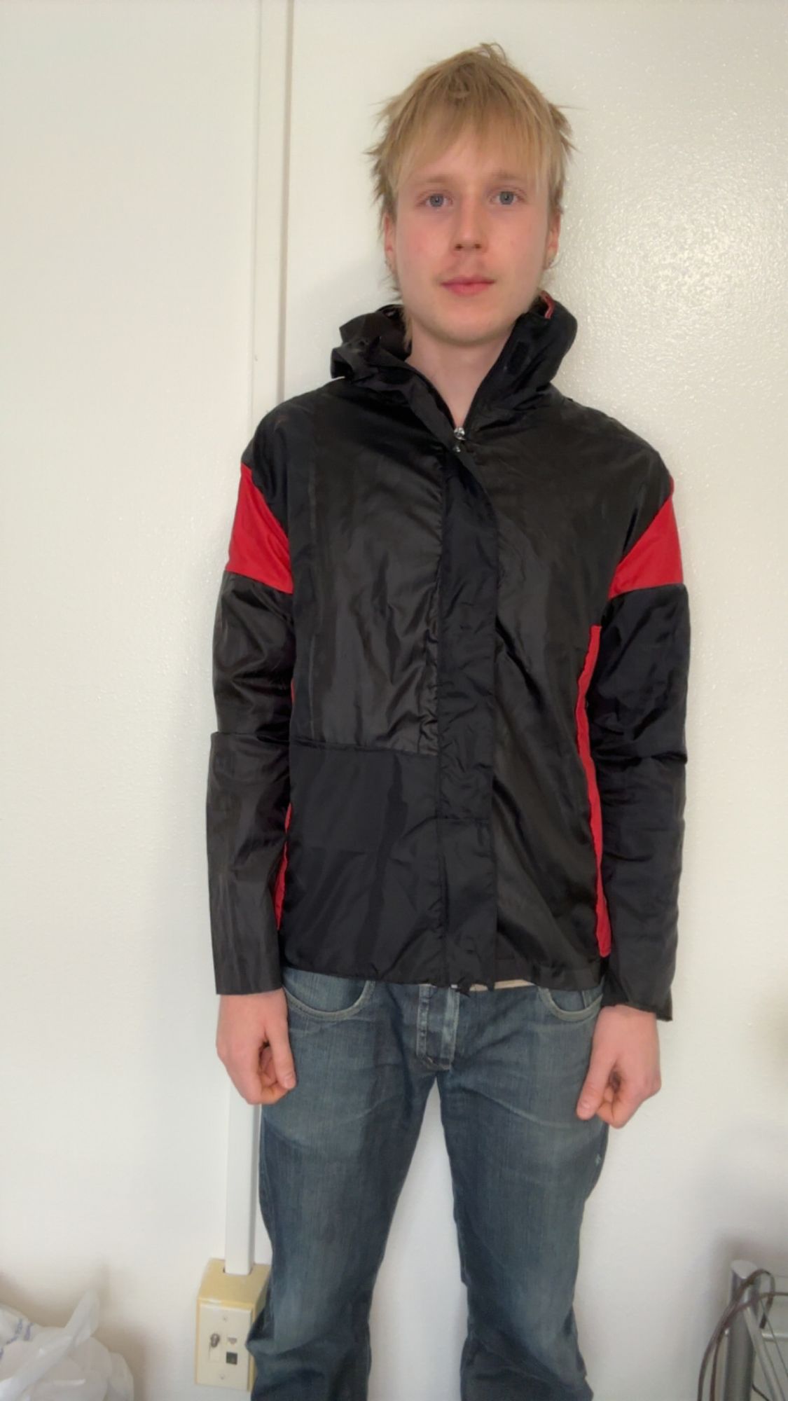 Rain jacket worn open at the front, over a henley